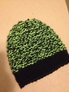 green and black knit hat